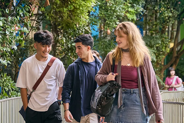 Students walking campus path