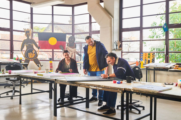 Student and teacher in a painting class