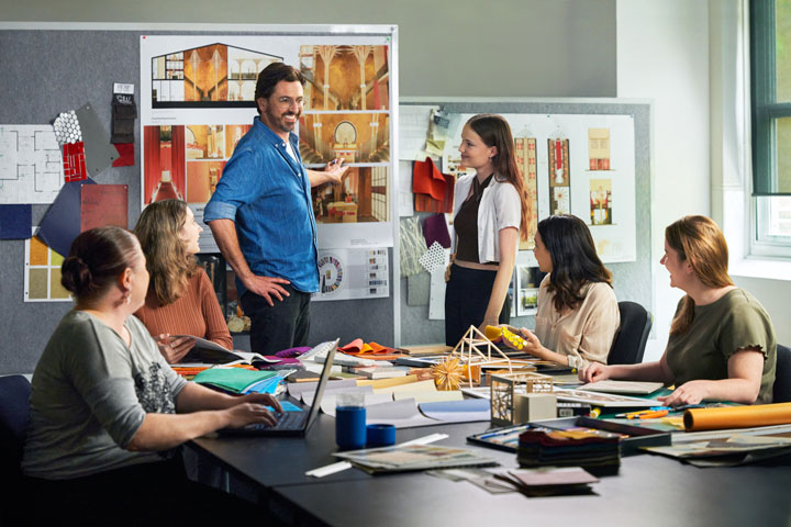 Classroom setting with an Interior Design instructor and student