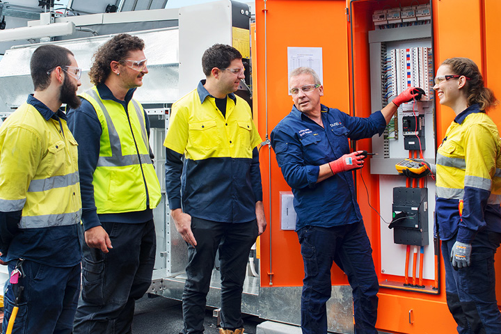 Electrotechnology teacher engaging with students