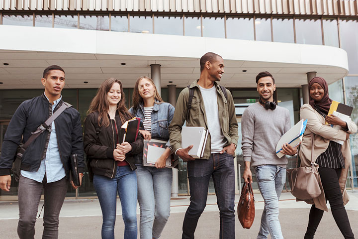 Group of young students leaving class together.