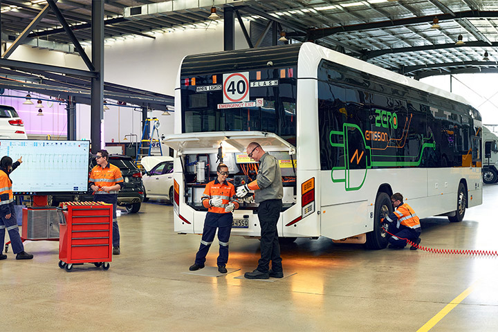 Mechanics in a workshop working on an electric bus