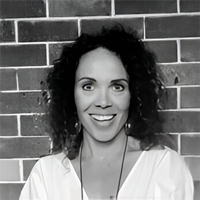 Black and white headshot of Laura Washington, smiling.