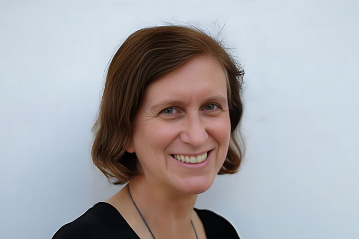 Belinda Maudson, Entertainment Design teacher at TAFE NSW, smiles warmly at the camera. She is dressed in a black top and a simple necklace, with her hair neatly styled in a side part.