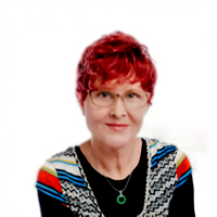A headshot image of Lydia Kullik smiling at the camera. She is wearing a bright coloured patterned shirt over a black top, and has bright red hair and glasses.
