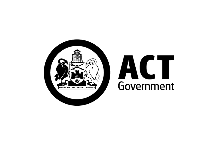 ACT Government logo featuring a circular black border enclosing a detailed black-and-white coat of arms with a crown, shield, and supporting figures, accompanied by the text “ACT Government” in bold black letters on a white background.
