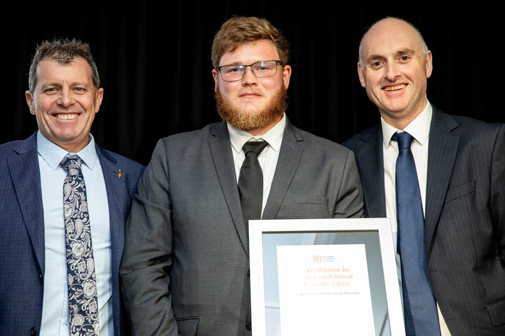 Bailey Govett stands between TAFE NSW Newcastle Head Teacher of Bricklaying David Lange-Smith and CEO of Brick and Block Careers Luke Radford, proudly holding his framed Apprentice of the Year Certificate.