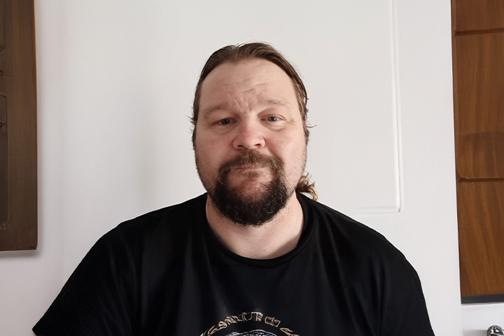 TAFE NSW graduate David Robertson looks directly at the camera.