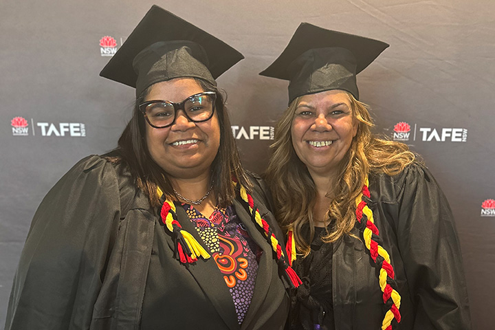 Proud and smiling mother and daughter graduating students, in cap and gown. Yaltara Penrith (L) and Candy Kilby (R).