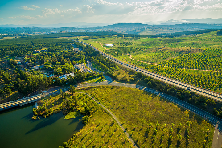 An aerial view of a green field