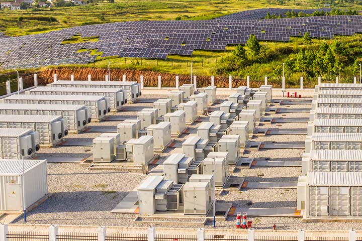 Large-scale energy storage system installation in a field.