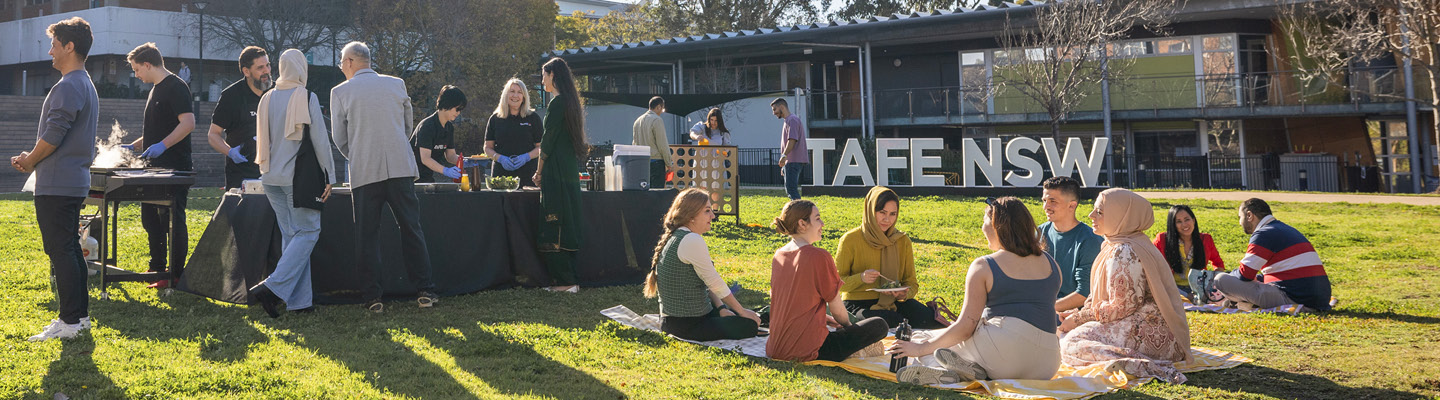 Students and staff from various cultural backgrounds enjoying a BBQ at TAFE NSW
