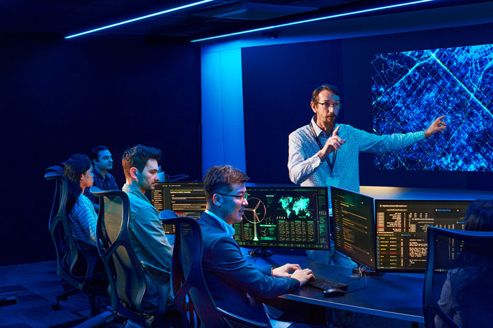 Instructor teaching cyber defense strategies