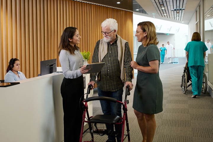 People looking after an elderly man