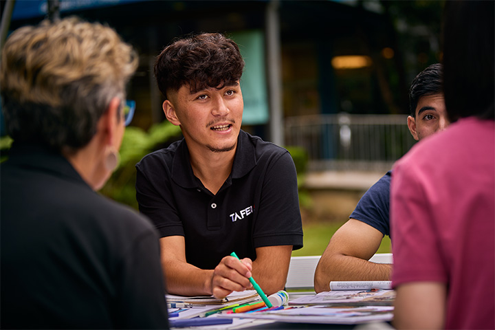 Students collaborating on project outdoors at TAFE campus