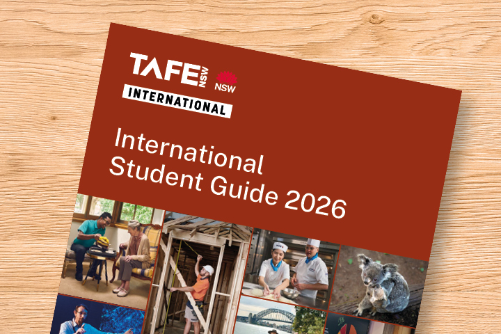 Cover of the TAFE NSW International Student Guide 2026 brochure, featuring white title text on a brown background with small images along the bottom showing student life and educational activities.