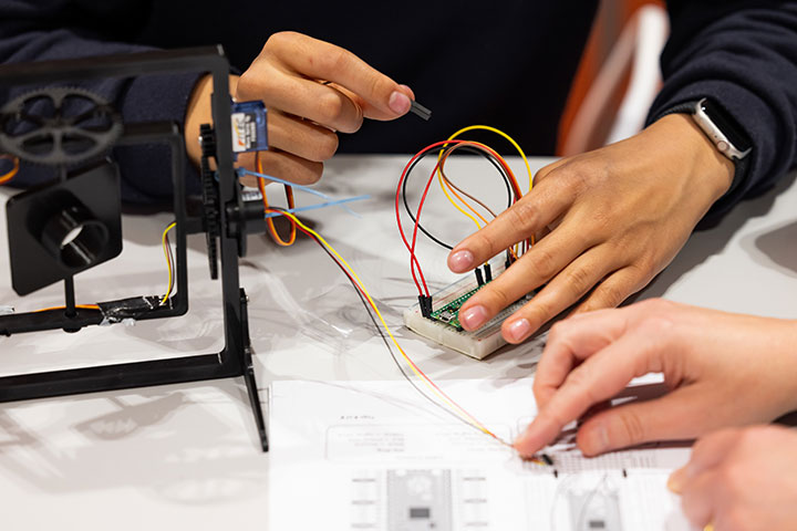 Students working on some intricate wiring