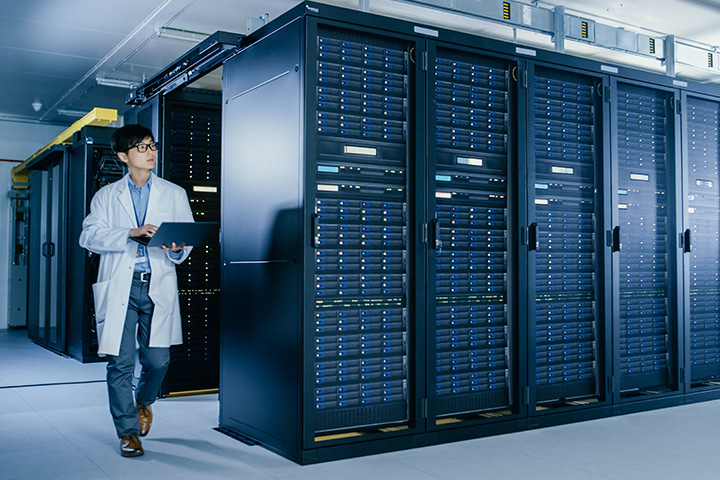 IT professional monitoring network servers in a data center.