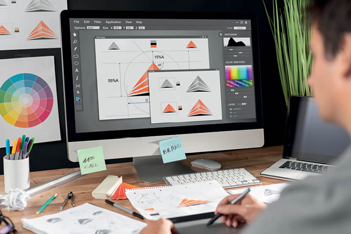 Student working on designs on a Mac.