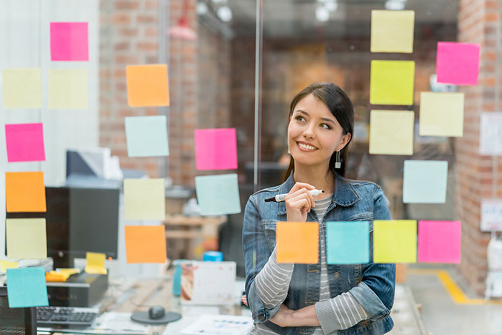 Professional woman at the office generating sales strategies.