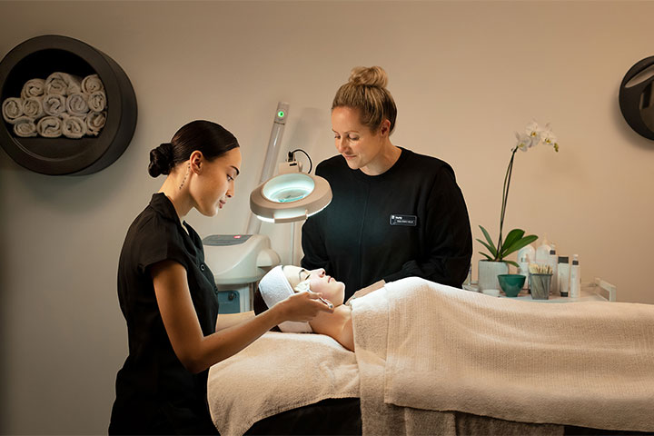 Beauty therapy session with student and teacher.