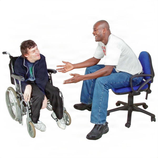 Two men having a lively conversation, one in a wheelchair and the other on an office chair. 
