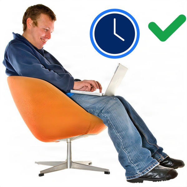 Man sitting in an orange swivel chair using a laptop.