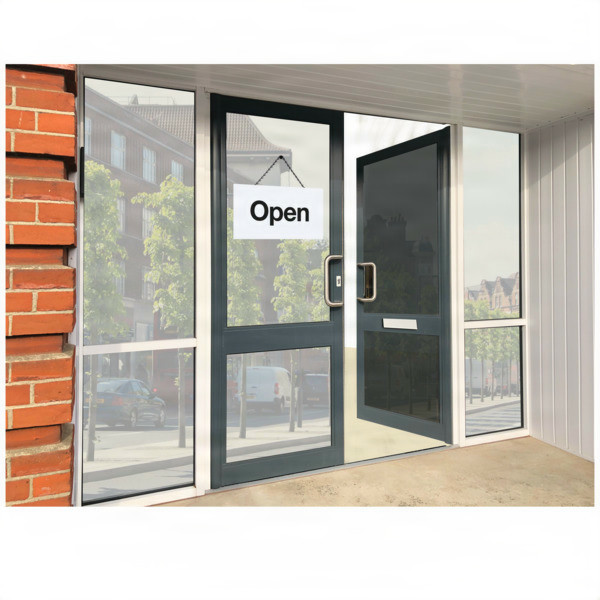 Glass entrance door with an 'Open' sign and view of trees and buildings outside.