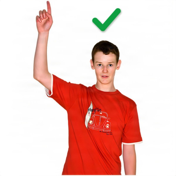 Young person in a red t-shirt pointing upwards with a green tick above their head.