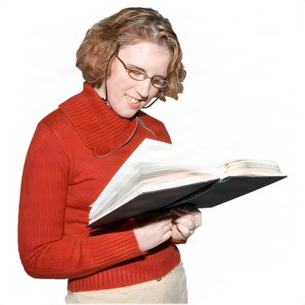 Person wearing glasses in a red sweater reading a large book.