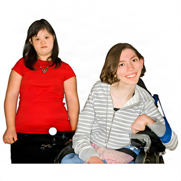 Two young women, one standing and one in a wheelchair, smiling warmly.