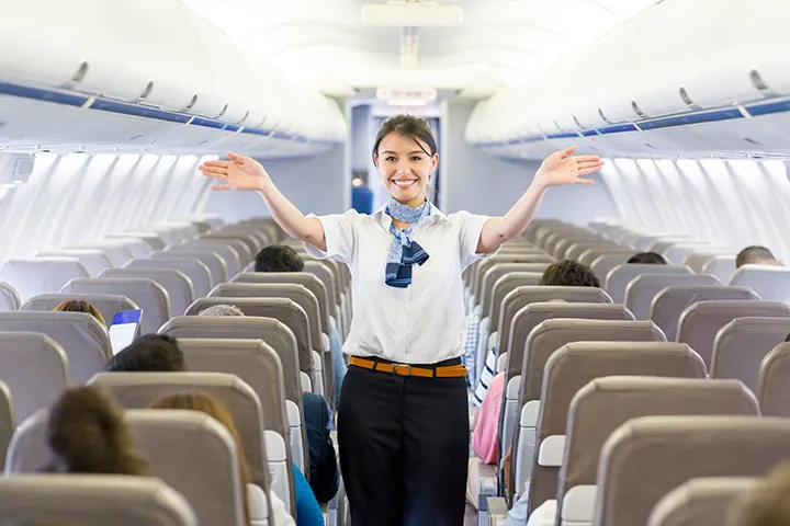 A female cabin crew member radiating elegance and professionalism in her uniform.