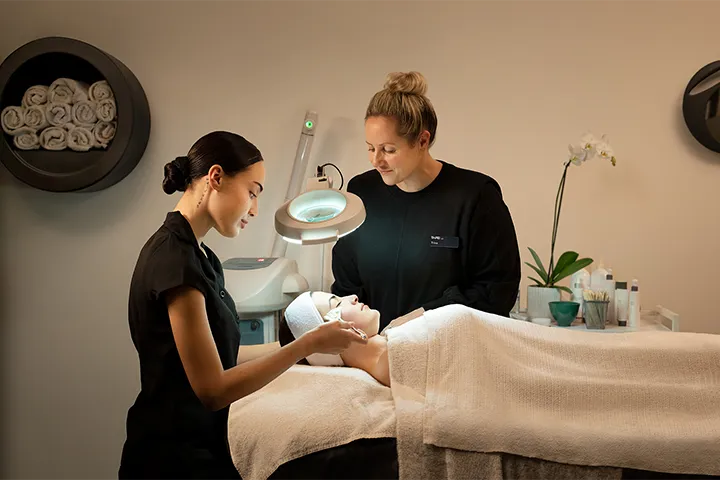 Beauty therapy session with student and teacher.