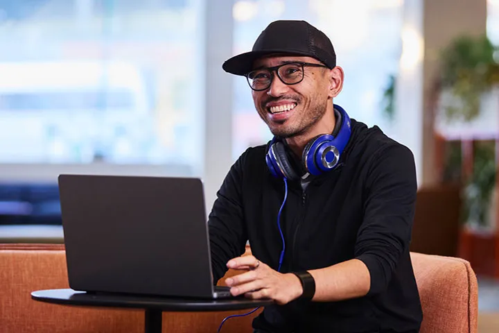 Person using a laptop in a learning setting.