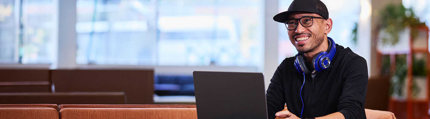 Person using a laptop in a learning setting.