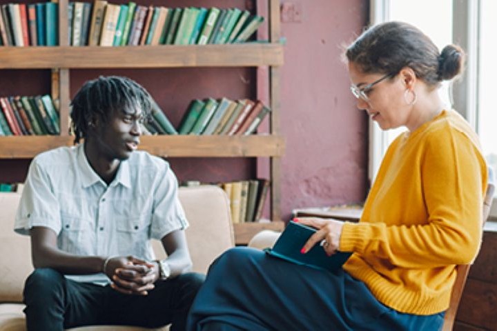 One-on-one trauma support consultation in a professional care setting.